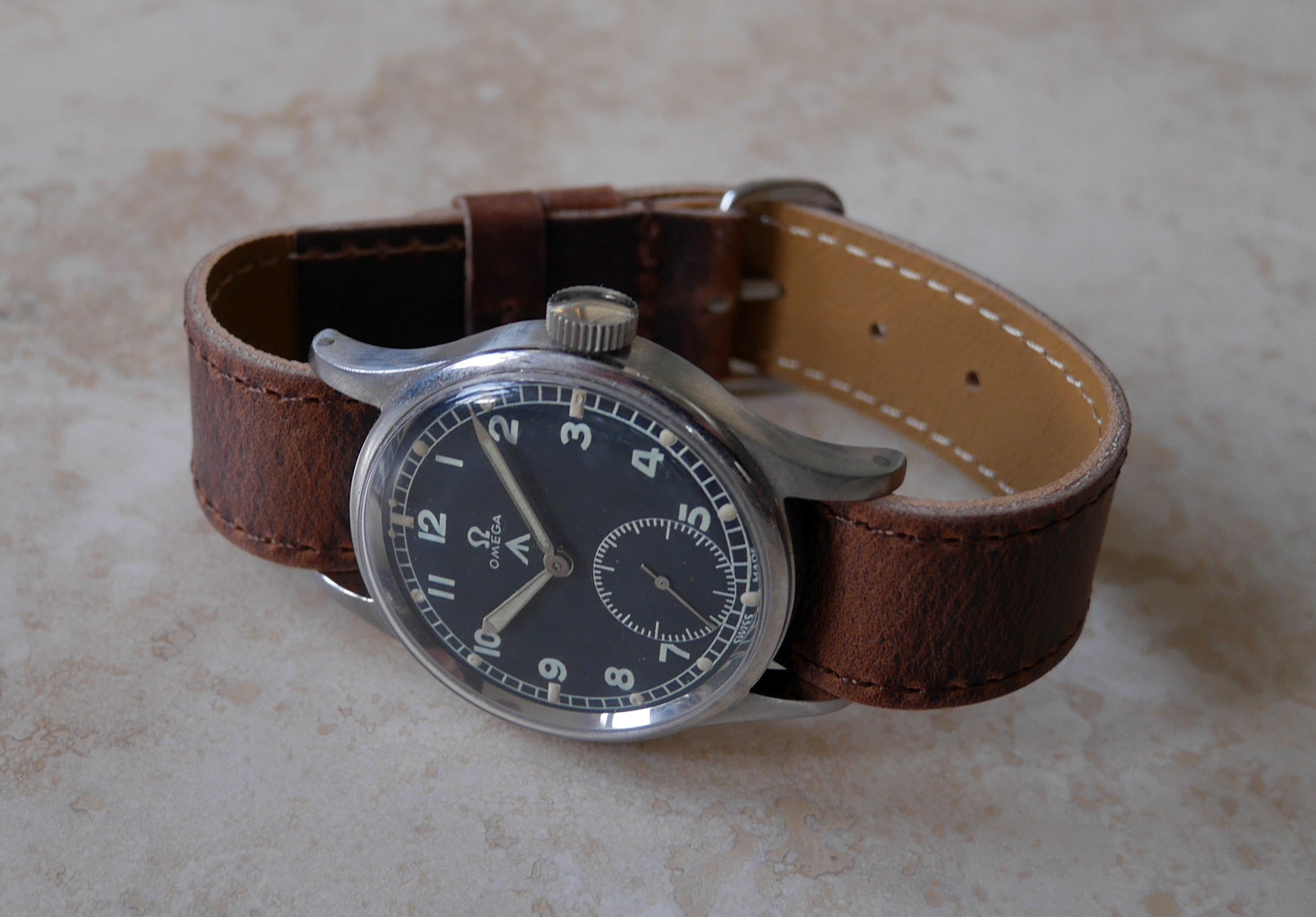 Leather RAF Type in brown oiled leather fitted to an Omega W.W.W. wristwatch