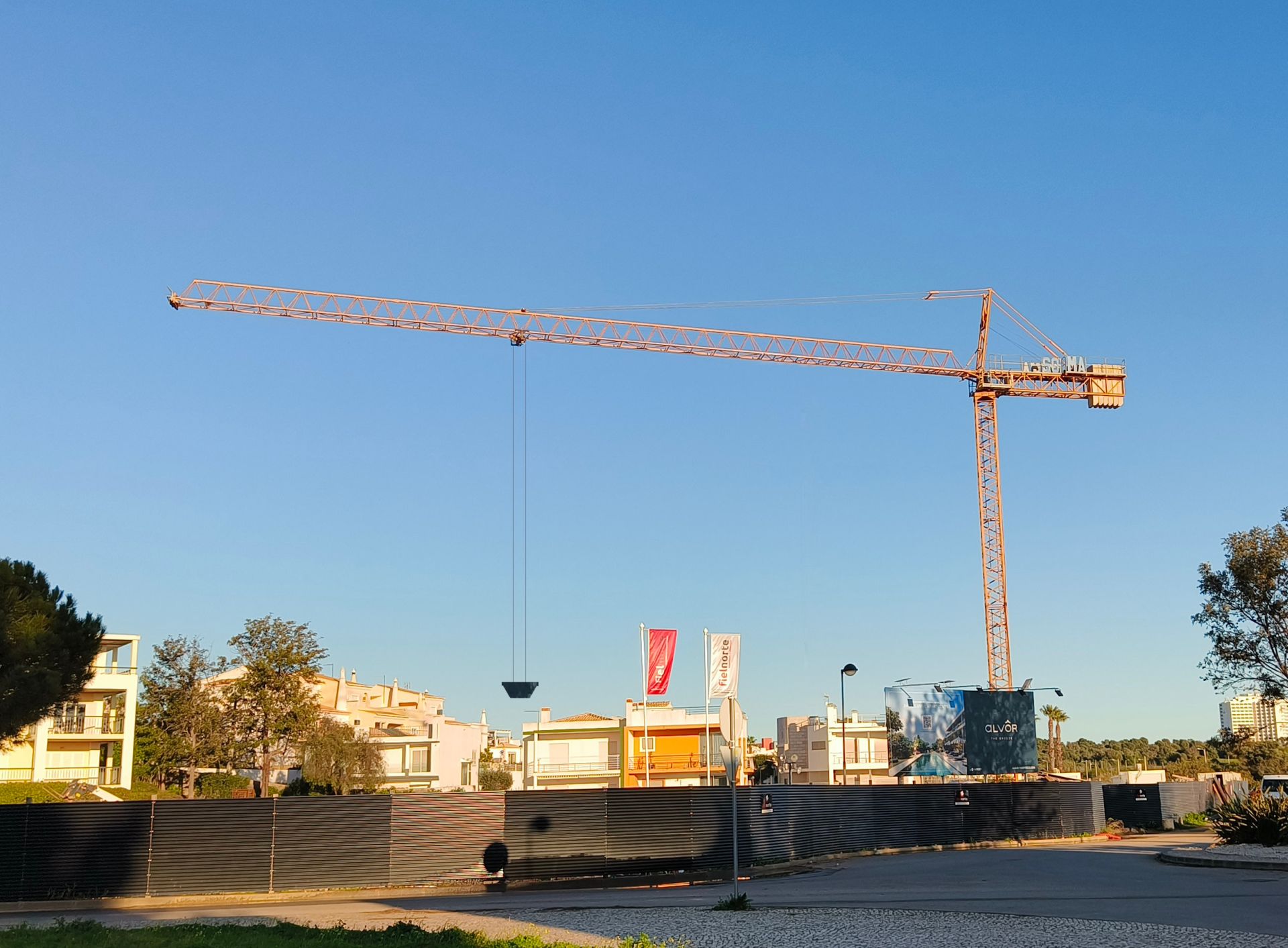 A skip hanging from a tower crane has a high Q